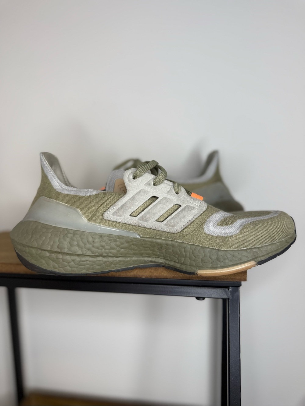 Adidas Ultraboost 22 sneakers in the Orbit Green and Beam Orange colorway